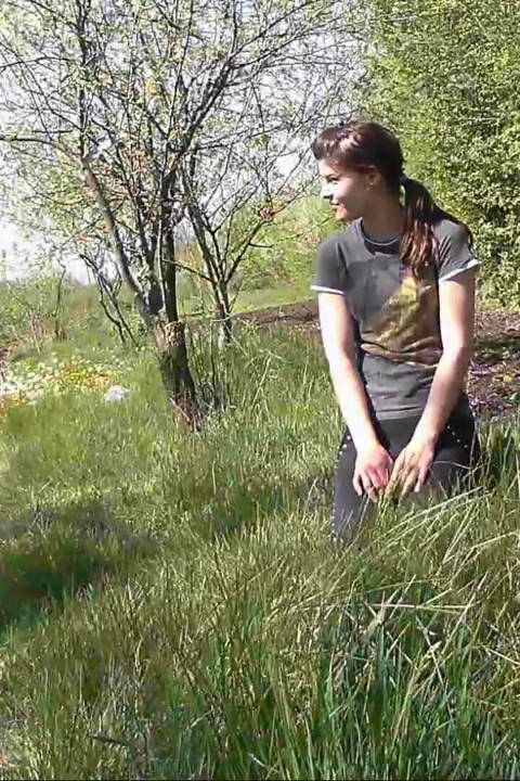 Pissing in grass on the side of the road