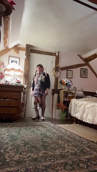 In schoolgirl outfit for an evening