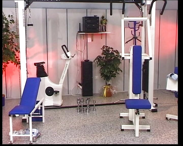 Petite blonde German babe rides two dicks in the gym