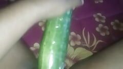 Busty slut inserts cucumber in her cunt