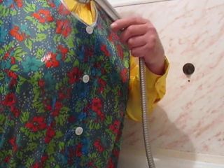Showering in a satin blouse and dederon apron.