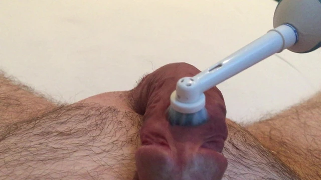 Masturbate with electric toothbrush