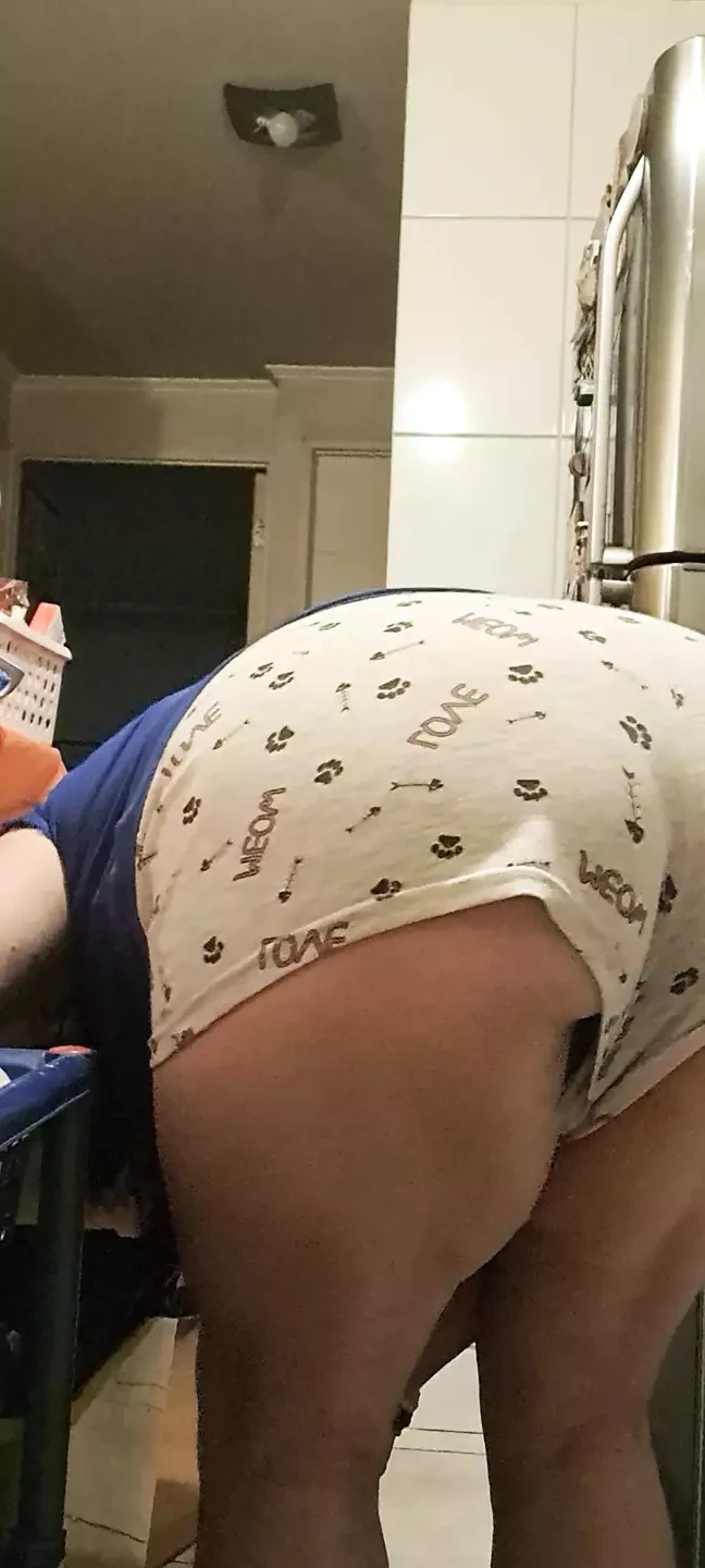 in the kitchen peeling potatoes and my husband looks at my shorts