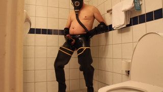 Rubbergloved wanking in the hotel shower wearing waders