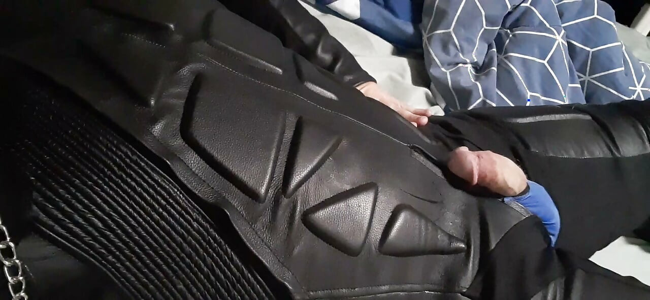 Biker cums in leather moto race suit