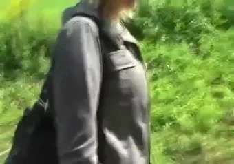 A pretty blonde gives her body in nature