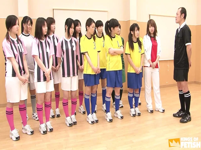 Japanese female team listen and take a lesson from their coach