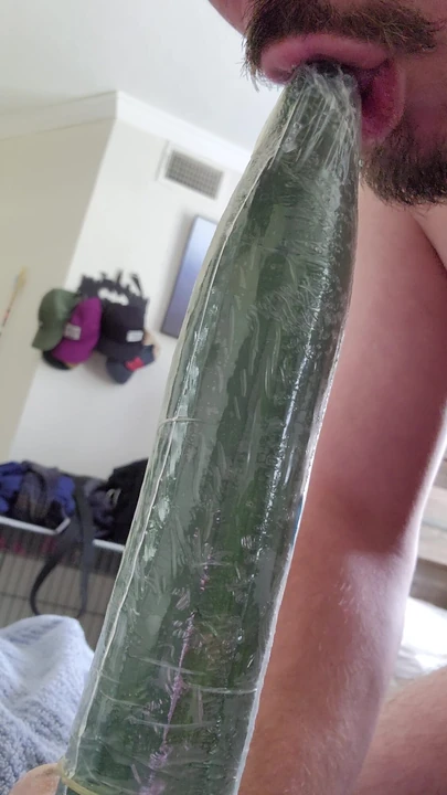 Horny bottom tries to deepthroat cucumber