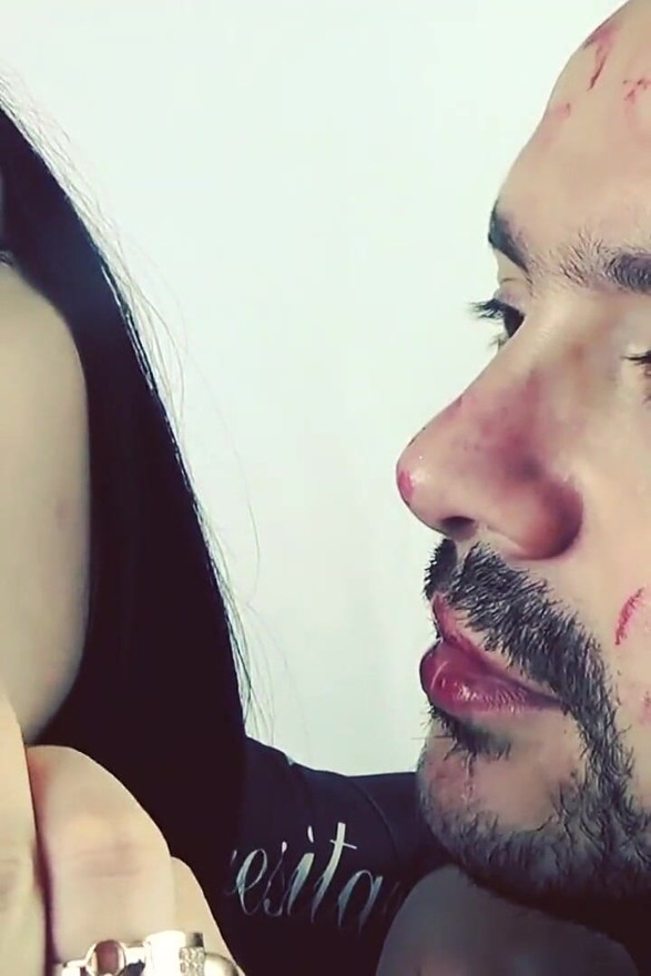 Covering Alex with red shiny lipstick kisses all over his face!