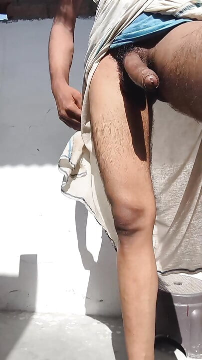 Young guy rubs his thick penis with oil