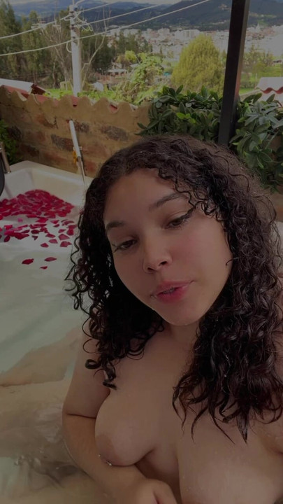 In a hot tub naked and wet waiting for you