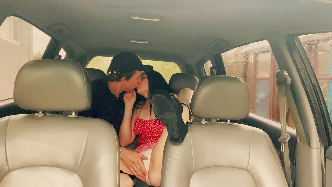 Wife cheating with a taxi driver in the car outside the house