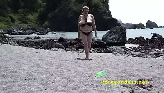 Big tits woman at the beach masturbates