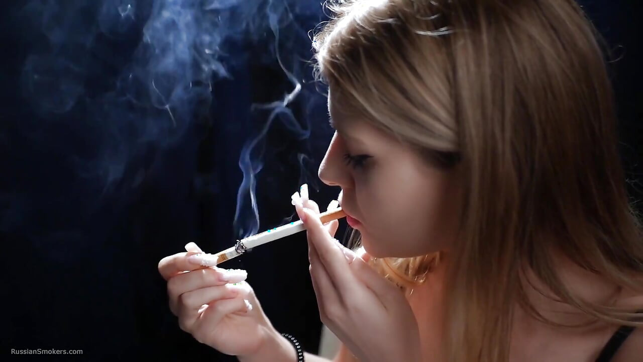 Sexy Blonde Is Smoking Two Reds in a Row