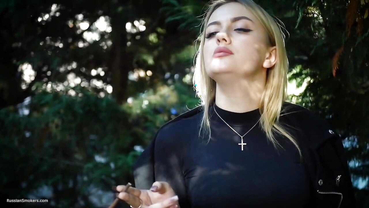 Hot Blonde Babe Smoking Two Black Cigarettes in Nature