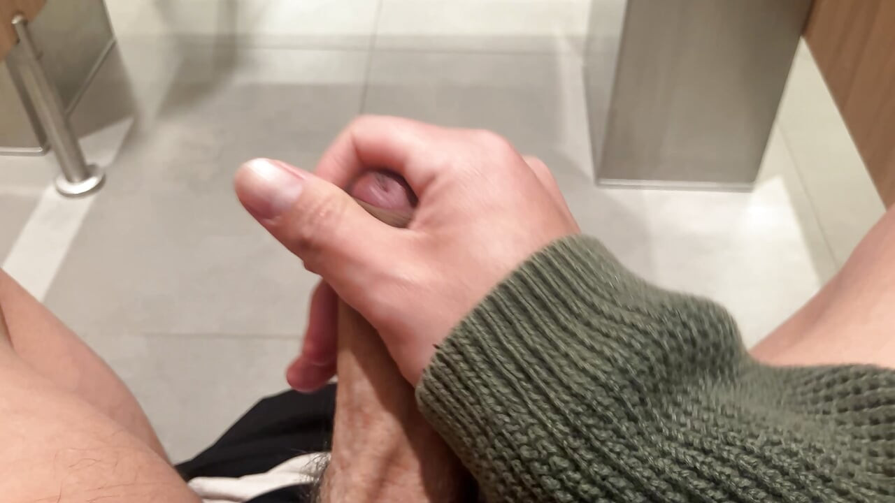 jerking off at the airport's restroom
