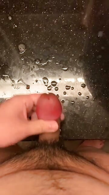rubbing my big swollen cock head until i sprayed all over the table