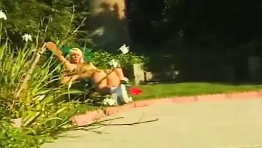 Two blonde lesbians pleasing each other in the backyard