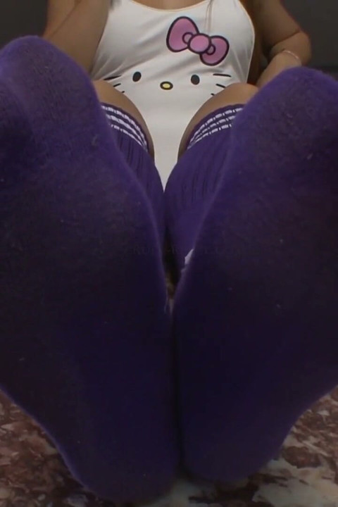 Mistress Sucking Lollypop with Long Socks on Her Feet