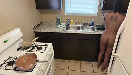 In the kitchen cooking and preparing food booty naked!