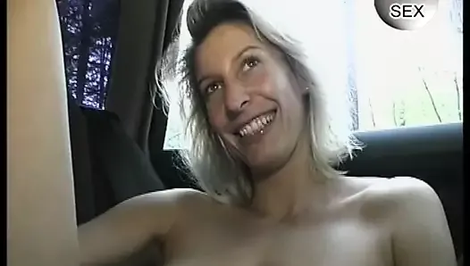 Cute German housewife gives a dildo show in the car - 90's retro