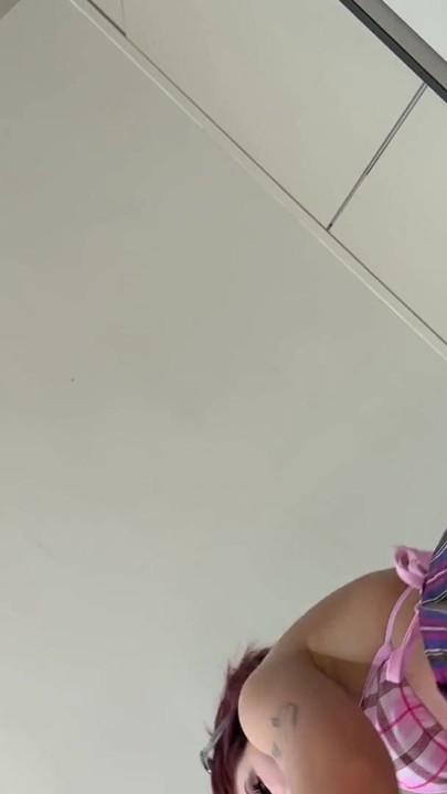 Real college girl in summer house prepares some fruits in the kitchen in the smallest bikini ever with a short skirt | Clip 1