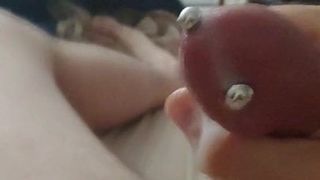 Pierced cock shoots huge load onto stomach