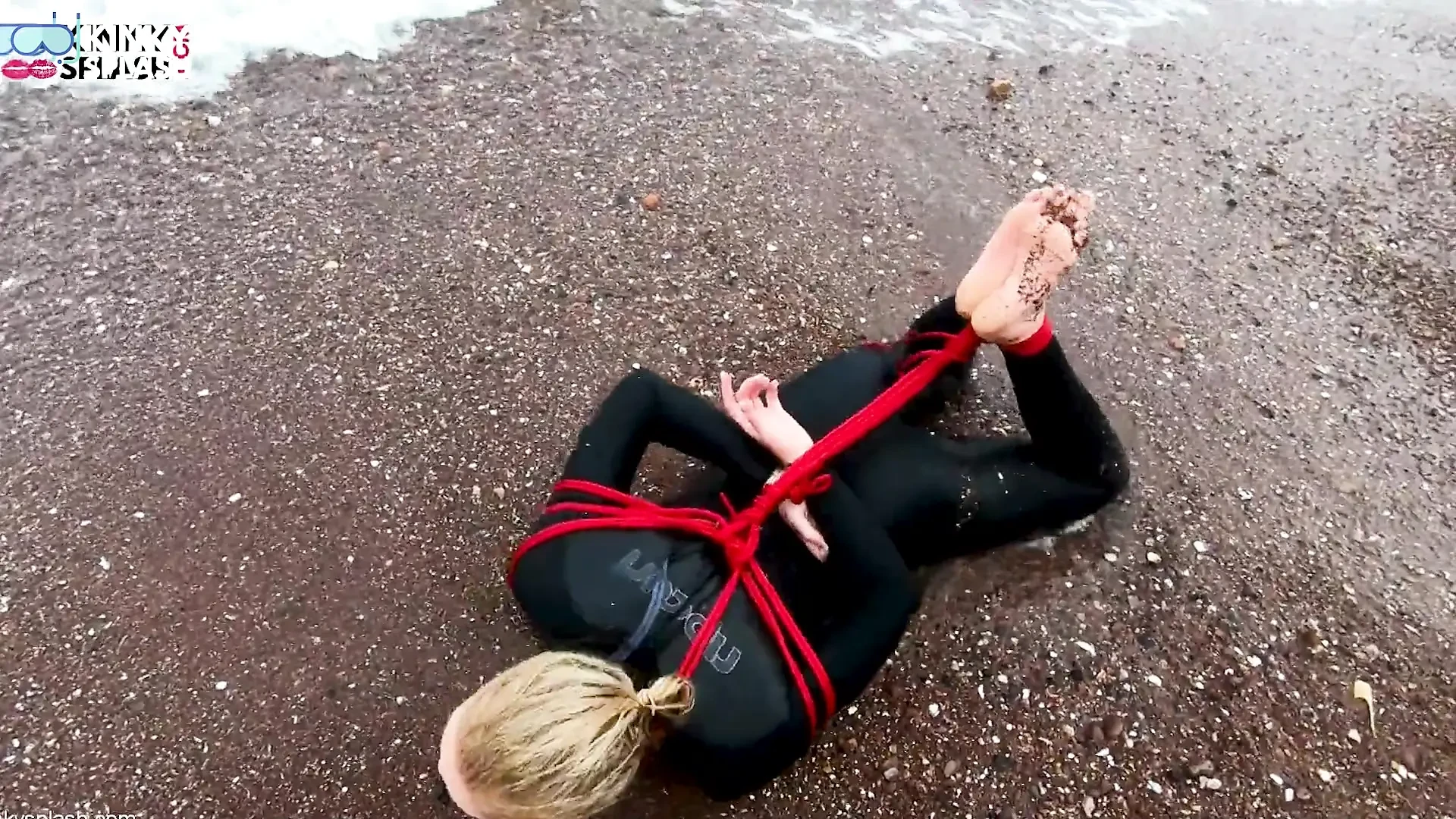 Hogtied in a Wetsuit – Rope Bondage Escape Challenge on the Beach