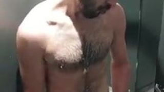 Jerking off next to the public shower