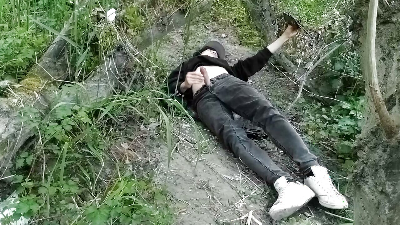 Cute Jon Arteen Gay twink jerks off outdoors, dry-humps the air, and shoots cum through a hole in his pants