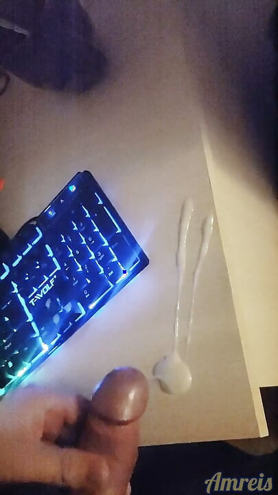 Gamer in the night. Cum on table.