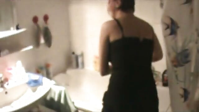 Brunette MILF with big boobs and round ass masturbating in the bathtub