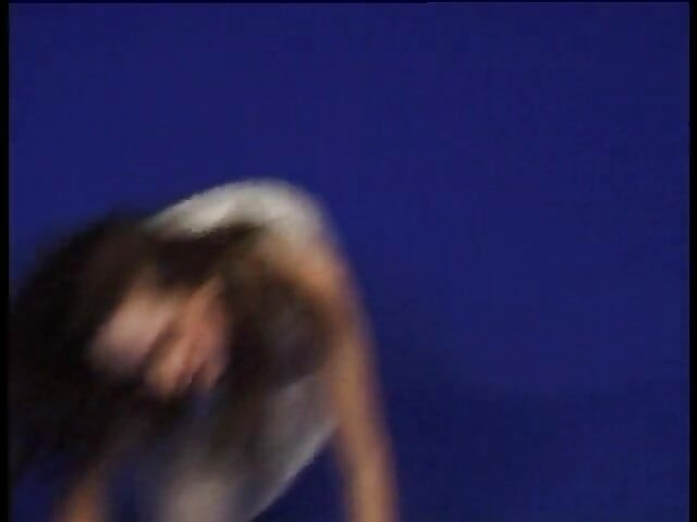 Pierced brunette teen is dancing and stripping off her clothes