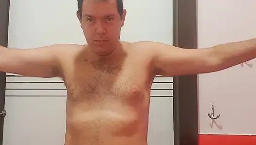 A boy completely naked in a station bathroom