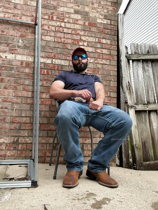 Booted Bearded Fella Cigar and Edge Out Back