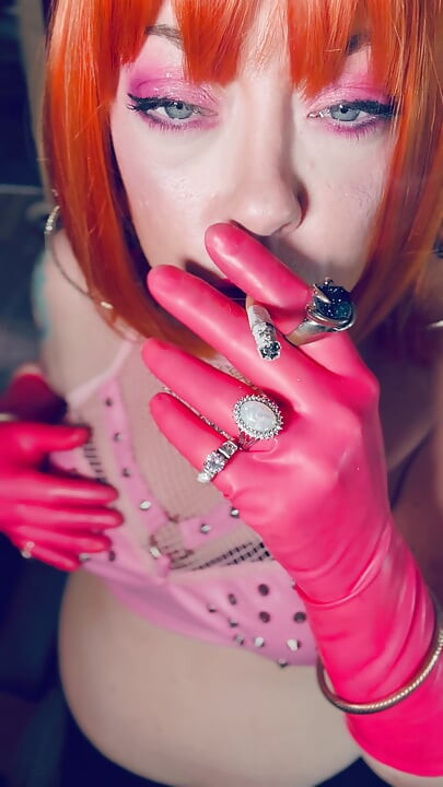 Sweet In Pink! Tina Snua Dressed In Pink Latex Gloves Smoking A Cork Cigarette - Snap Inhales Drifting Smoke OMI OME Dangles