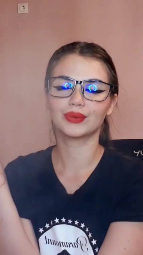 Sensual brunette smoking and wearing geek glasses | Clip 1