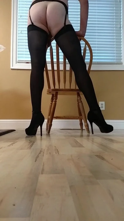 Long Leg Crossdresser strutting in stockings and heels