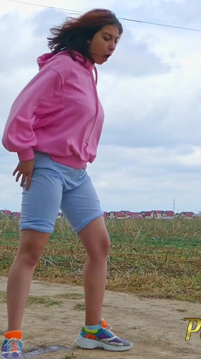 Wetting Her Jeans Outdoor - Desperate Hipster Girl Trying Hard to Pee - Pee Next to the Wheel of the Car