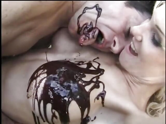Kinky dude and blonde MILF fuck while being covered in chocolate syrup