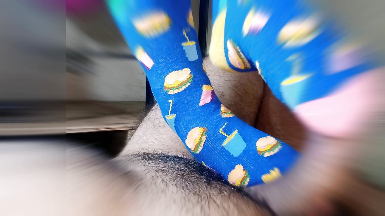 straw with feet wearing very funny stockings