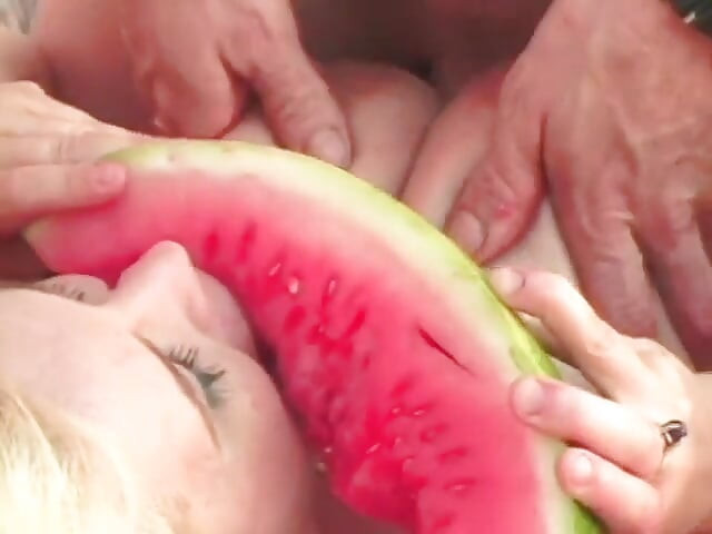 Kinky dude and blonde with huge tits get playful with a water melon then fuck outdoors