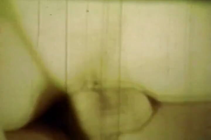 Worn Sepia Loop Captures Curly Retro Couple in Raw Bedroom Passion