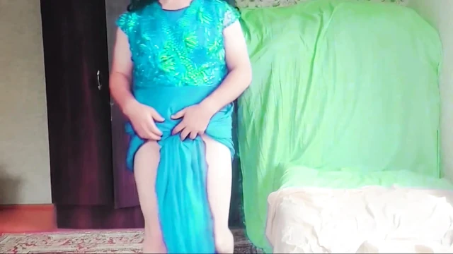 Adorable sissy posing with giant lollipop in bed