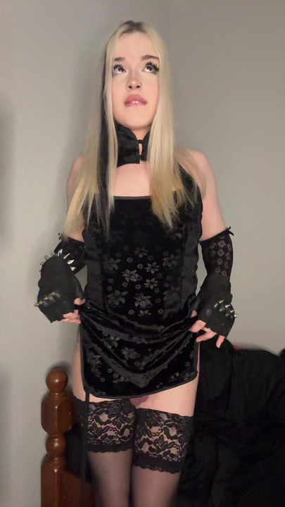 Goth blonde shows a small cock under her skirt