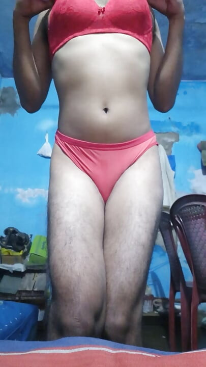 Young sissy crossdresser in her step sister's red bra and thong panties
