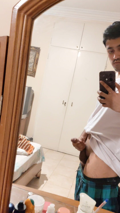 The Iranian boy shows him in front of the mirror and squeezes