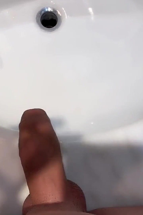 Quick Hotel Bathroom Cumshot Into Sink in Swim Trunks While Friend Is Gone