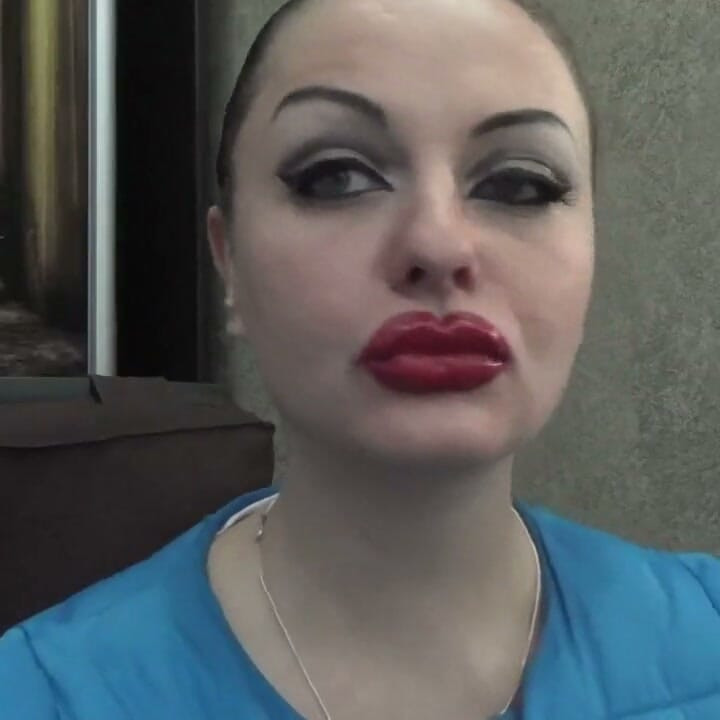 Sexy make-up huge red lips smoking