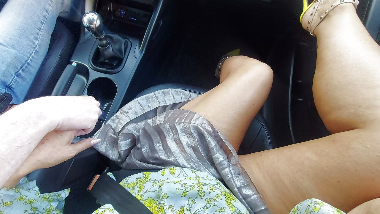 An elegant mature lady with beautiful legs in high heels seduces a taxi driver in the morning